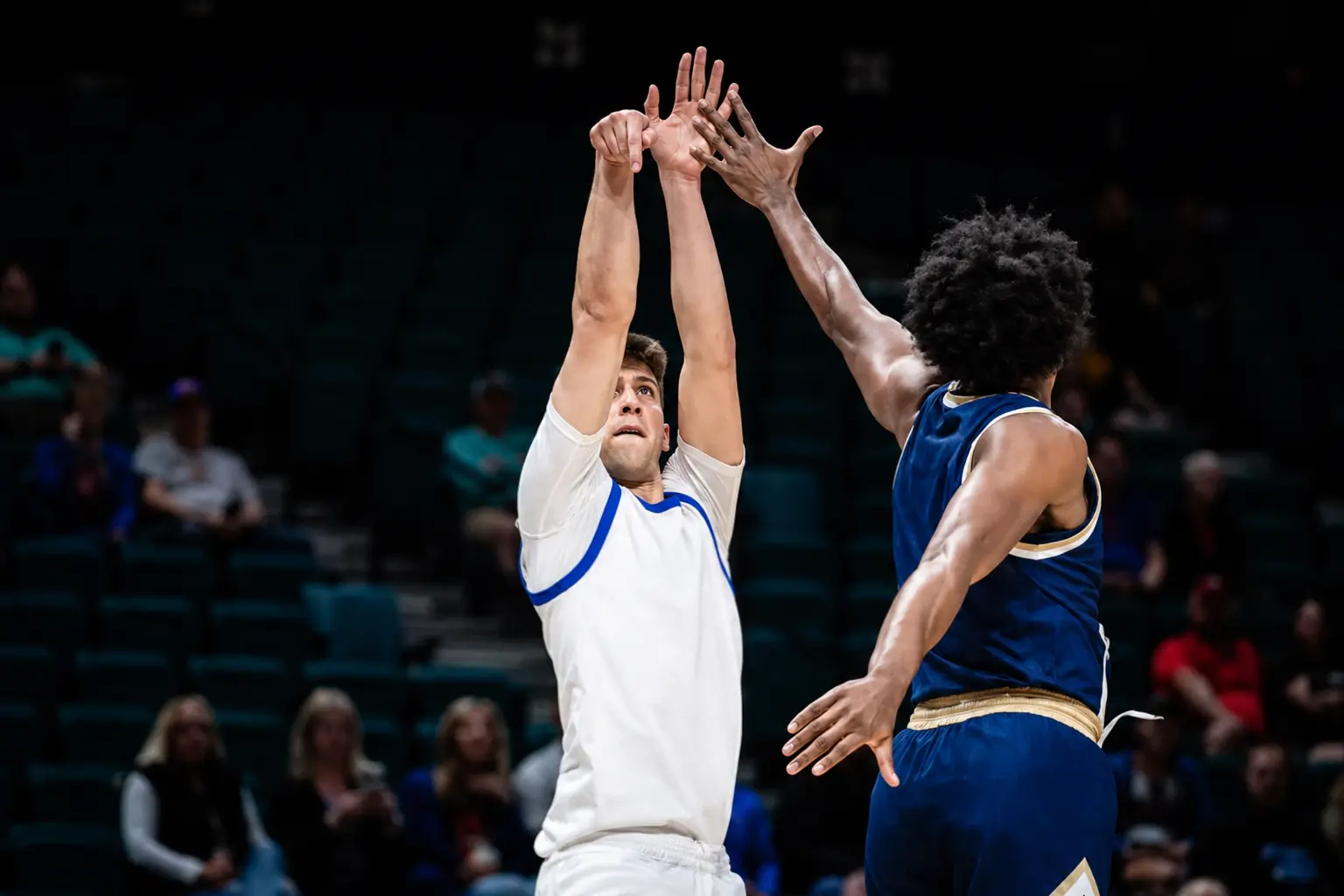 Boise State Men's Basketball player finishing at the rim during live play