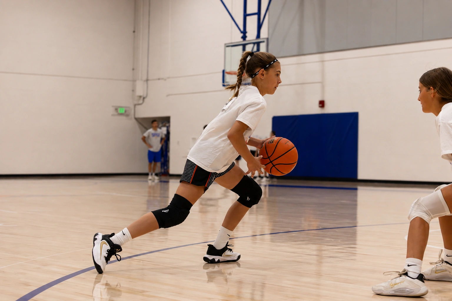 Camper finishing at the rim during a past basketball camp