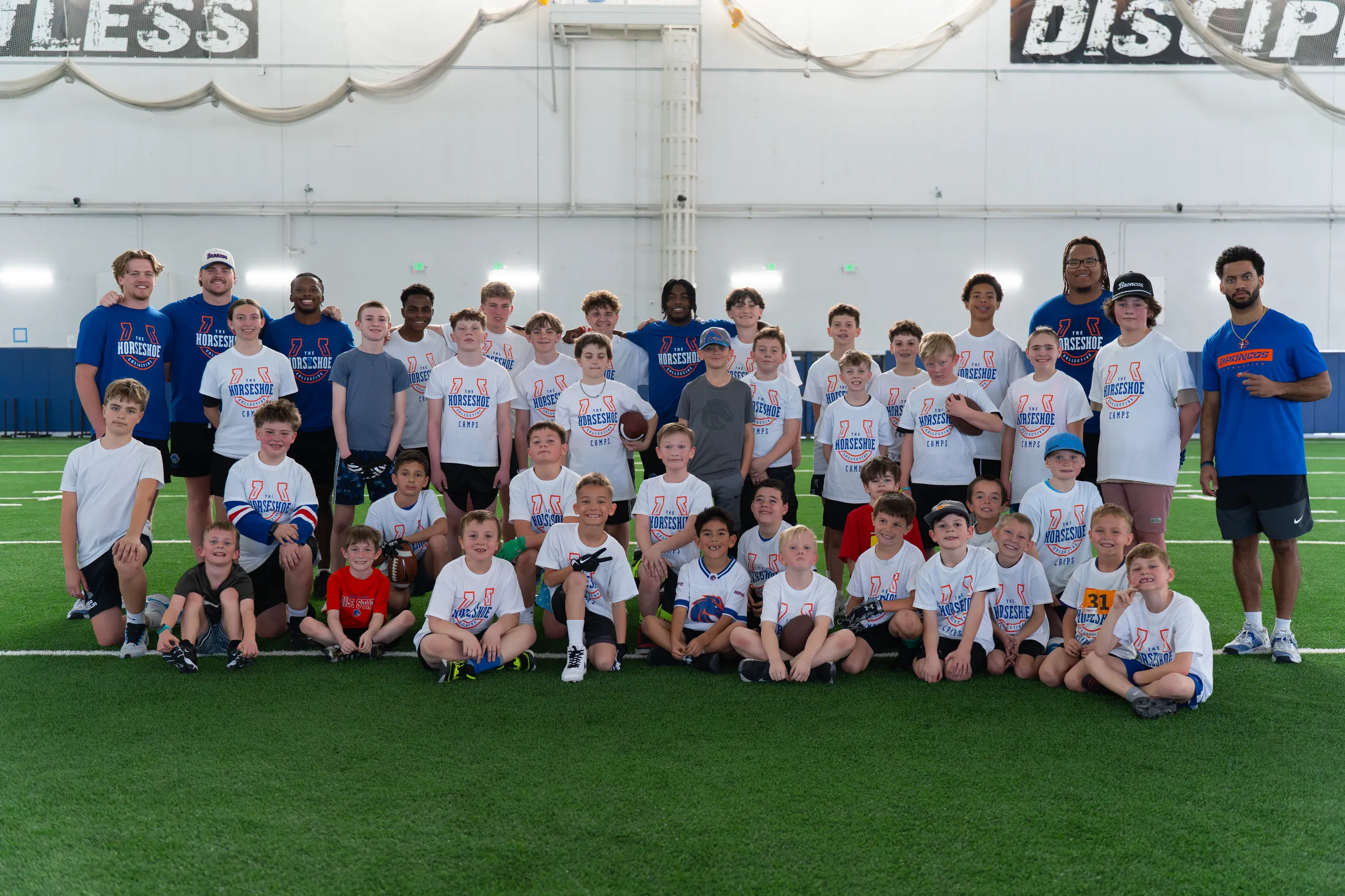 On-field action at a past Horseshoe football camp with Boise State players