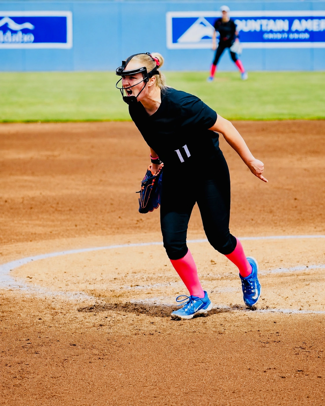 Loula-Rae McNamara reacting after a pitch in the circle